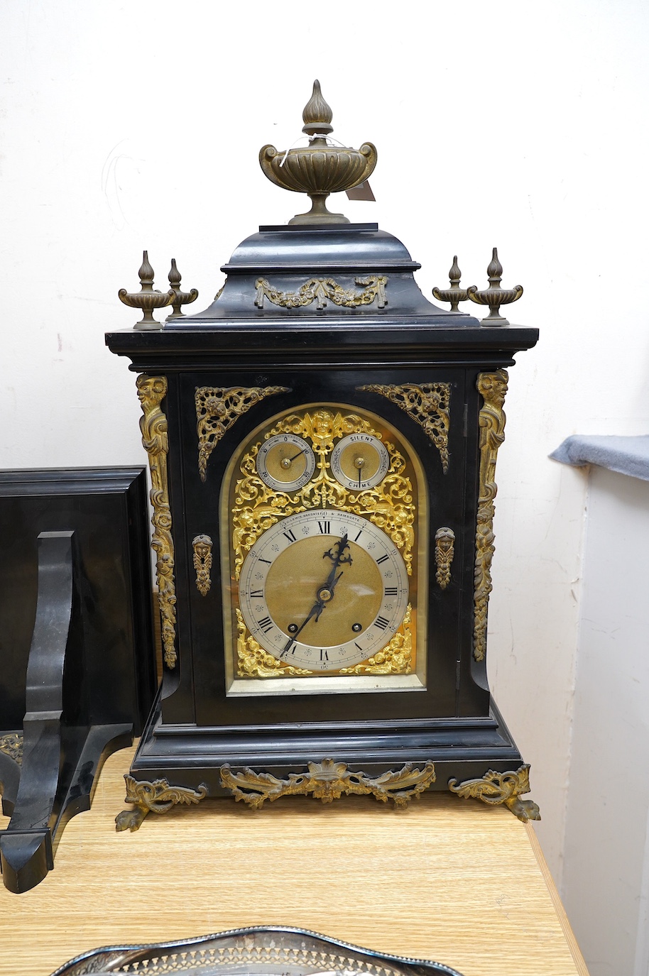 A large Edwardian ebonised mahogany and ormolu mounted bracket clock and bracket, movement by W&H Sch., striking on two coiled gongs, dial signed J. Lewis, Margate and Ramsgate, 71cm high. Condition fair to good, the clo